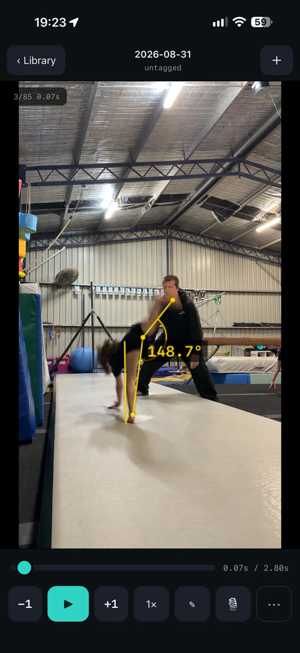 Invert Eye on iPhone: a gymnast on beam with an angle drawn at the hip reading 148.7 degrees.